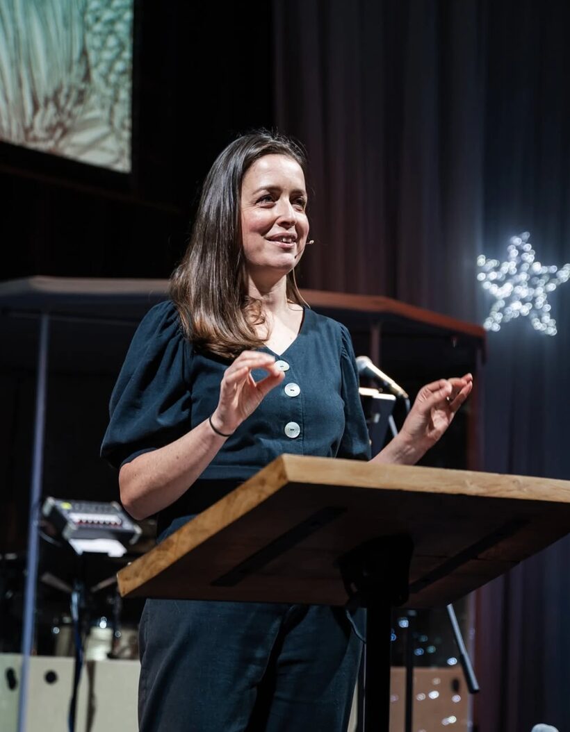 A speaker welcoming the congregation at a Christmas service at Hope Church