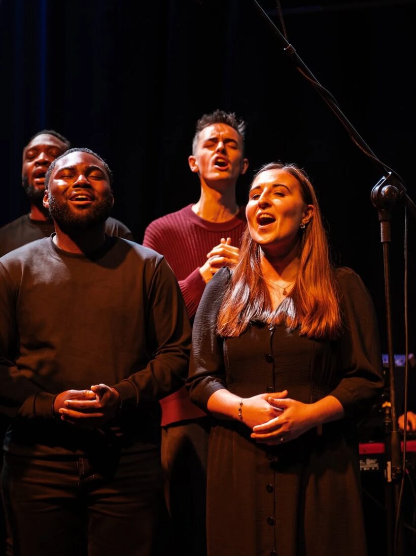 Singers worshipping together during a carol service at Hope Church