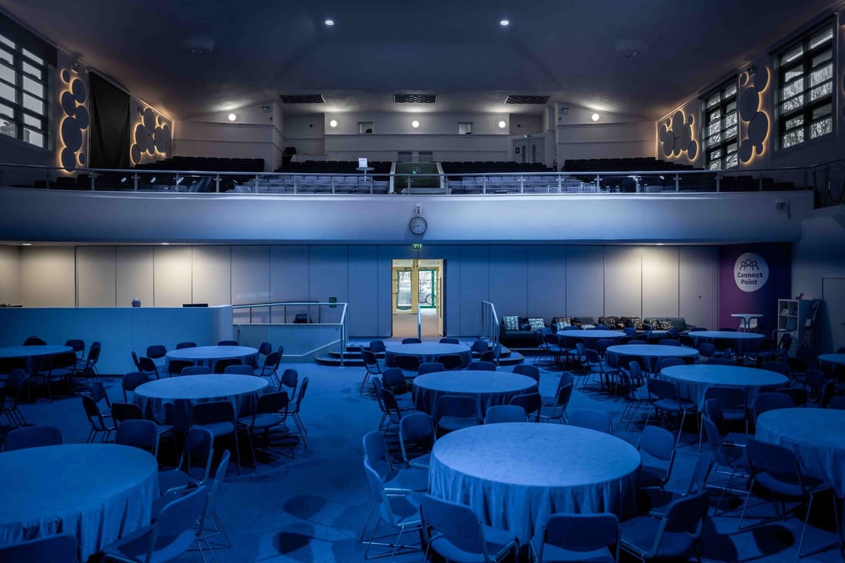 The Middle Brook Centre main hall set up with round tables for an event