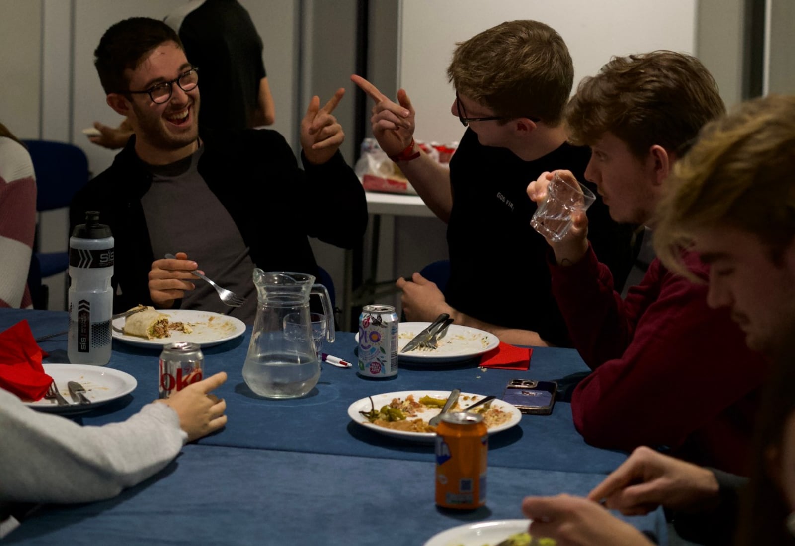 Hope Students laughing together over a shared meal