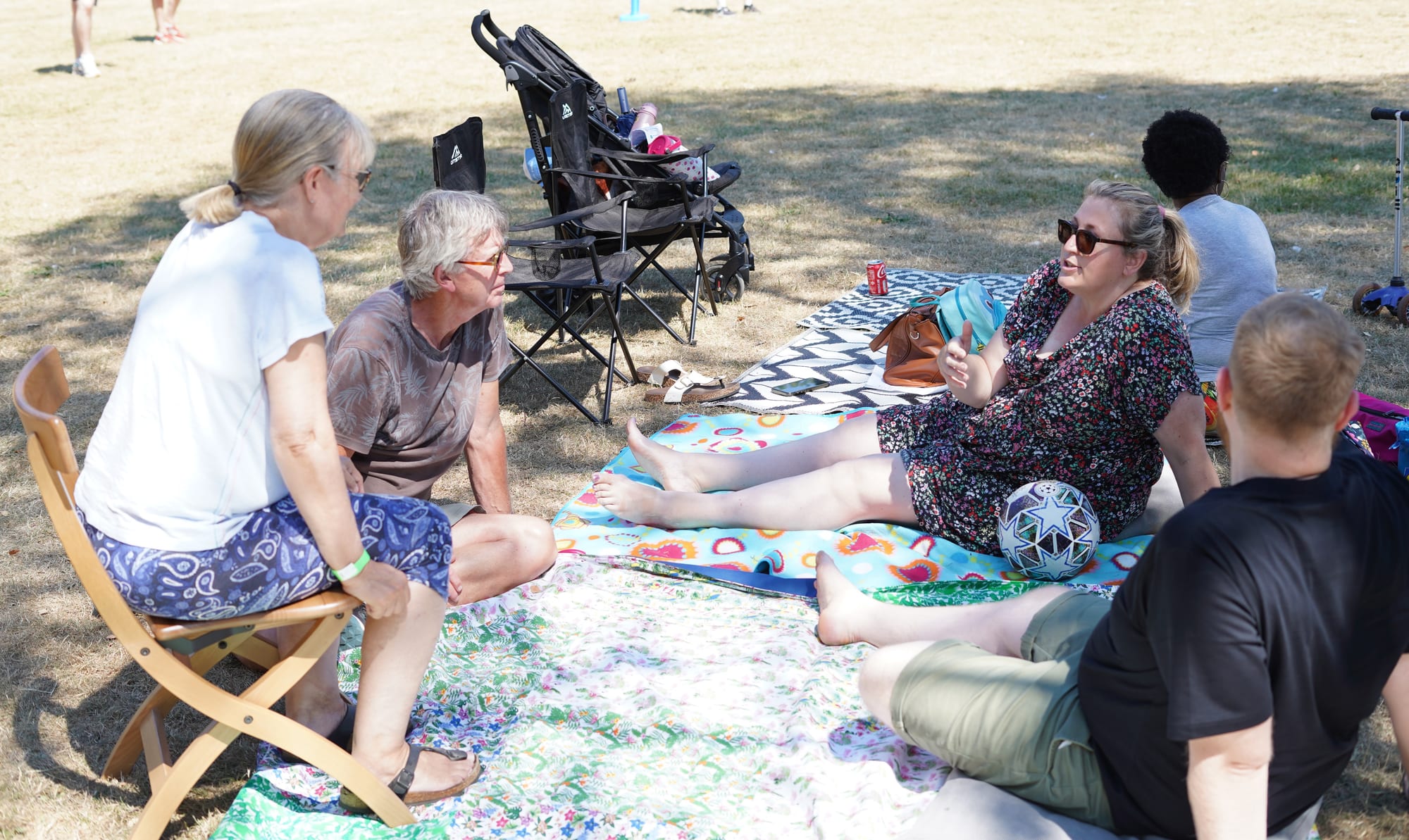 Church members enjoying a picnic together in the park