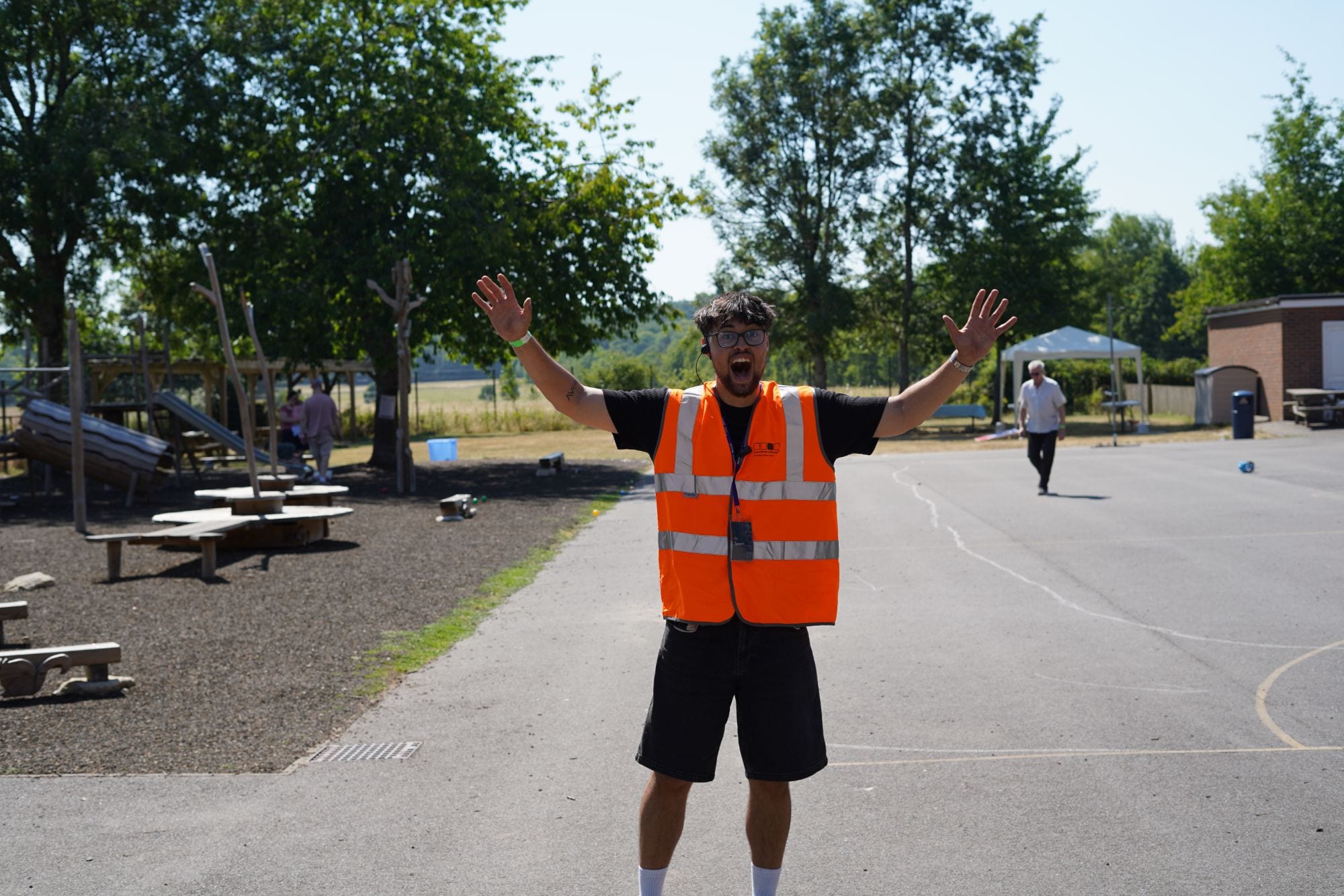 A Hope welcome volunteer cheering at an event